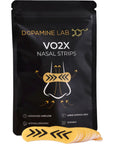 A black stand-up pouch of Dopamine Lab VO2X Nasal Strips with a small fan of yellow nasal strips placed in front on a white background.